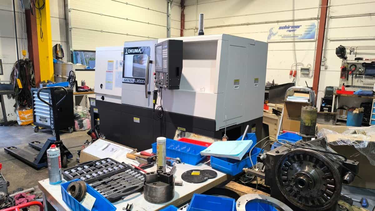 Okuma Genos L3000 CNC lathe undergoing repair in professional workshop